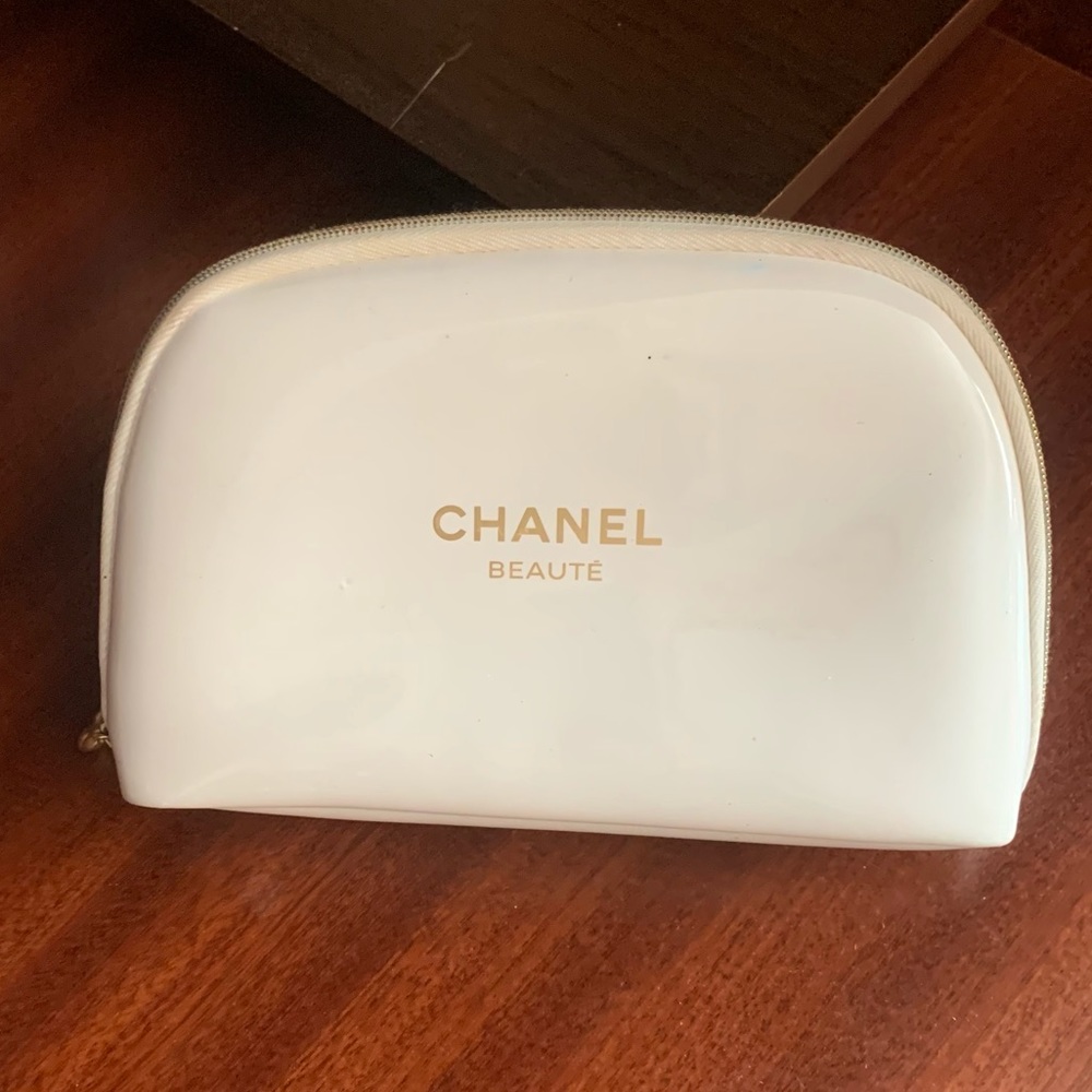 CHANEL cosmetic bag. red stain of lipstick inside.Last photos.  good Condition.